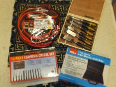 A set of heavy duty jump leads, a 170 piece HSS metric drill bit set, a 12 piece carving chisel