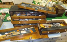 An ebonised tool chest and contents of various mainly steel and wooden handled tools including items