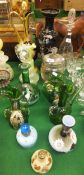 Eleven glass items to include green glass jugs, a vaseline glass decanter with flared rim, a
