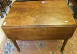 A 19th Century mahogany Pembroke table with single end drawer and dummy drawer on ringed and