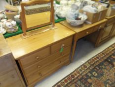An Ercol pine framed dressing mirror, together with matching chest of two short and two long drawers