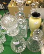 Five clear glass decanters together with an art glass yellow ground slim vase