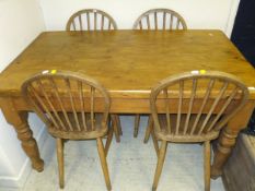 A Victorian pine farmhouse kitchen table with rounded rectangular top over a frieze drawer, and a