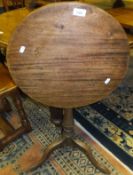 A 19th Century mahogany tea table, the circular snap top on turned and reeded pedestal to cabriole