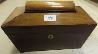 An early 19th century mahogany tea caddy of sarcophagus form