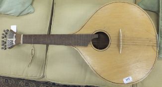 A Portuguese guitar with pear shaped body