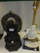 A Chinese blanc de chine figure of a Deity in seated pose, now as a table lamp base, together with a