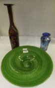 A Mdina brown glass bottle, a green glass broad rimmed dish and a blue glass Murano style vase