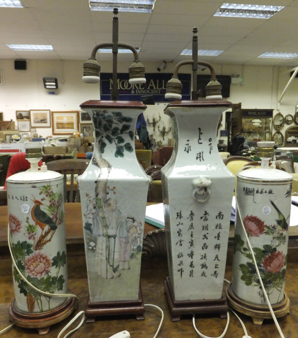 A pair of Oriental porcelain rectangular sectional table lamp bases, each painted with birds in