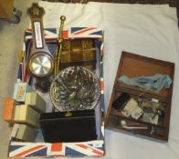 A box containing various cased cutlery sets, an aneroid barometer thermometer, a mahogany writing