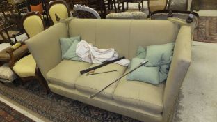 An upholstered Knowle style sofa on squat bun feet   CONDITION REPORTS  General signs of wear to the