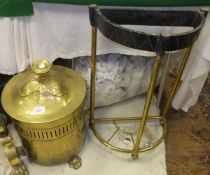 A circa 1900 brass coal bin of cylindrical form, the domed cover to pierced sides with ram's head