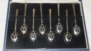 A cased of eight Turner and Simpson silver and enamel decorated coffee spoons   CONDITION REPORTS