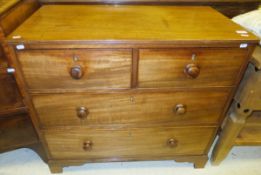 An early 19th Century mahogany chest, the top with moulded edge above two short and two long drawers