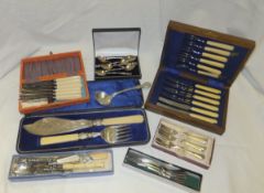 A box containing assorted cutlery to include fish servers, bread forks, cake forks, etc., together