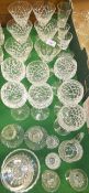 A set of seven Waterford Crystal cut glass wine glasses, a set of five Waterford Crystal glasses