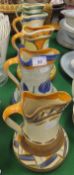 A collection of five Myott Son & Co. hand-painted jugs of flared form with pinched rims