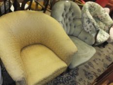 A Victorian buttoned upholstered salon armchair and a circa 1900 upholstered salon tub chair