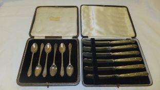 A cased set of six silver teaspoons (Sheffield 1925), and a cased set of six silver handled butter
