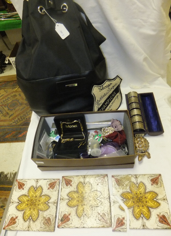 A collection of miscellaneous items to include a black backpack, a quantity of costume jewellery,