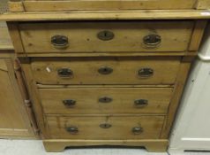 A Victorian pine chest of three drawers on bracket feet