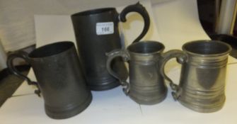 A collection of four various glass bottomed pewter tankards, a pewter tapering cylindrical box and