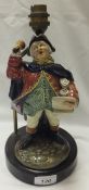 A Royal Doulton figure "Town Crier", model HN2119, drilled to base, now as a table lamp