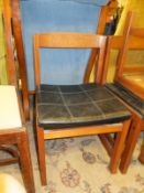 A set of eight mid 20th Century teak framed bar back dining chairs by Ulferts of Sweden