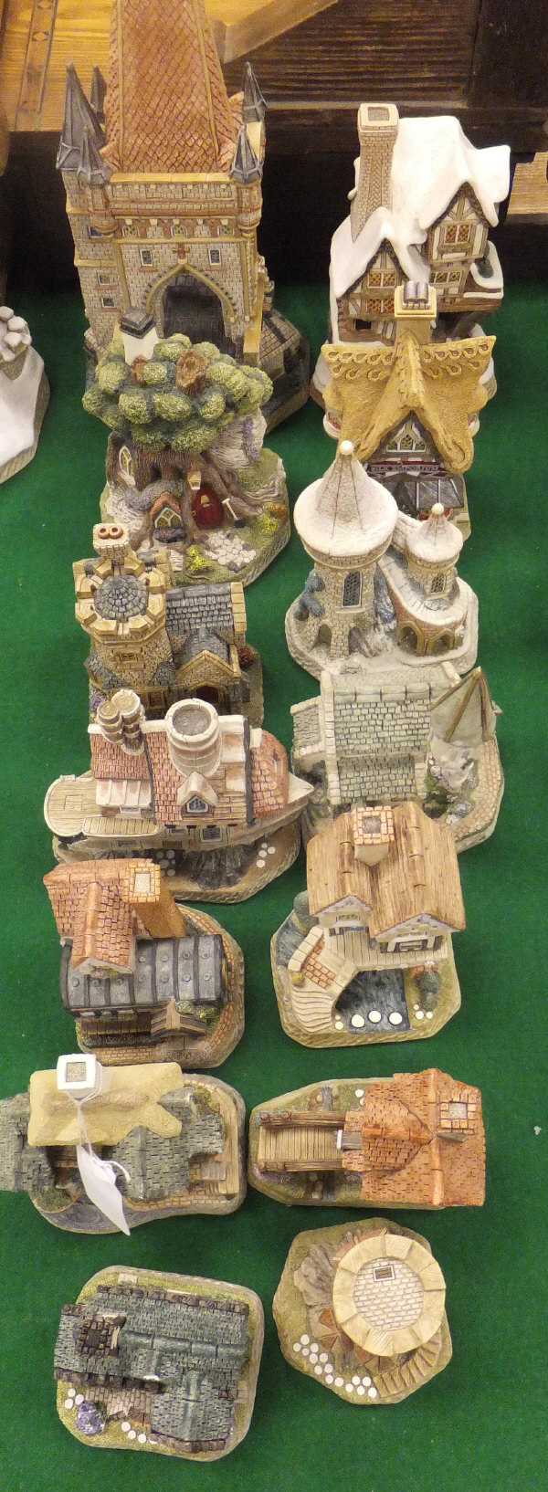 A collection of 14 David Winter cottage ornaments to include Gateway to Prague, Mr Brownlow's, The