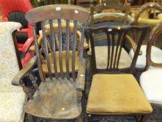 A Victorian slat back Windsor armchair, a beech smoker's bow chair, a rush seat ladder back elbow