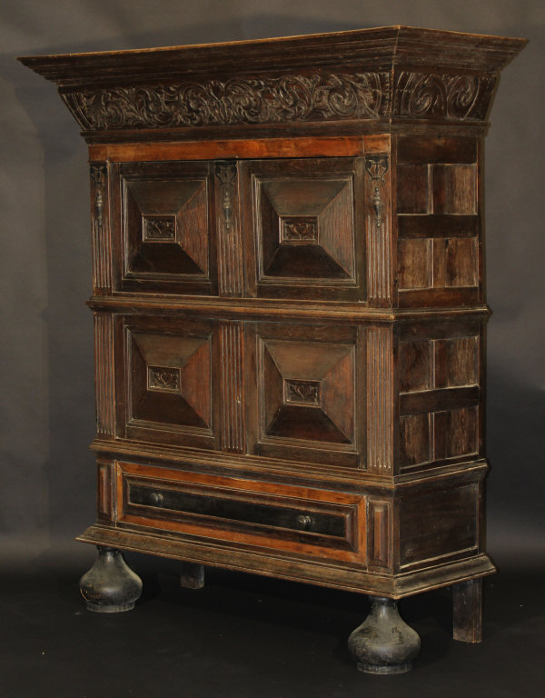 A 19th Century Dutch oak cupboard with two cupboard doors above a further two cupboard doors and a