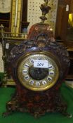A circa 1900 French boulle work decorated mantel clock with visible escapement, the dial with