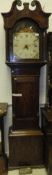 An oak cased long case clock with broken scroll pediment, inlaid shell decoration motif to the