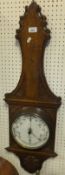 A late Victorian oak cased aneroid barometer by Charles A. E. Jolly of Mansfield