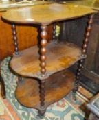 A rosewood three tier whatnot on bobbin supports