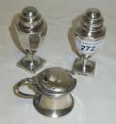A pair of Edwardian peppers of baluster form (Sheffield 1905), together with a silver lidded