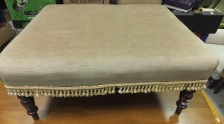 A Victorian mahogany footstool of large proportions, the rectangular top upholstered in beige velour