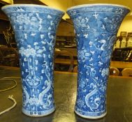 A pair of Chinese porcelain vases of tapering cylindrical form with flared rims, painted in