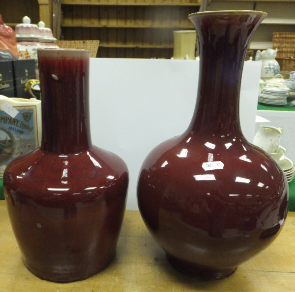 Two Chinese sang-de-boeuf glazed vases   CONDITION REPORTS  Larger vase with with crack to neck /