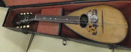 An early 20th Century mandolin with label to interior "Mario Casella.....", in case
