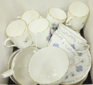A collection of Royal Worcester coffee cans and saucers and Royal Osbourne teacups and saucers,