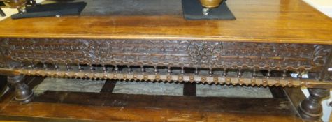 An Anglo-Indian hardwood rectangular topped coffee table with carved and baluster decorated frieze