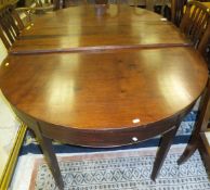 A Regency D end dining table with two extra leaves raised on square tapered legs