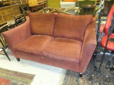A modern upholstered two seat sofa on square supports   CONDITION REPORTS  Some thread coming