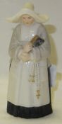 A Royal Worcester candle snuffer as a nun, date marked for 1903