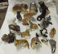 A large collection of Russian Lomonsov and other animal ornaments, to include giraffe, otter, lion