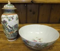 A Chinese vase decorated with bird amongst branches and butterflies with four character mark to