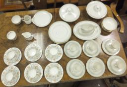 Six Minton "Haddon Hall" pattern teacups, saucers and side plates, together with cream jug and sugar