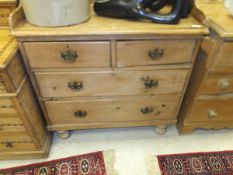 A Victorian pine dressing chest, the three quarter galleried top above two short and two long