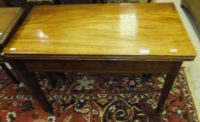 An early 19th century mahogany tea table, the rectangular top with moulded edge over a plain